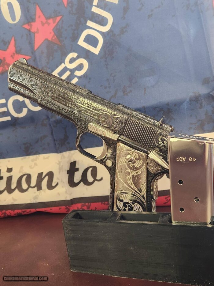 Colt custom, one of a kind, Govt 1911 .45 ACP 2 tone nickel fully engraved.